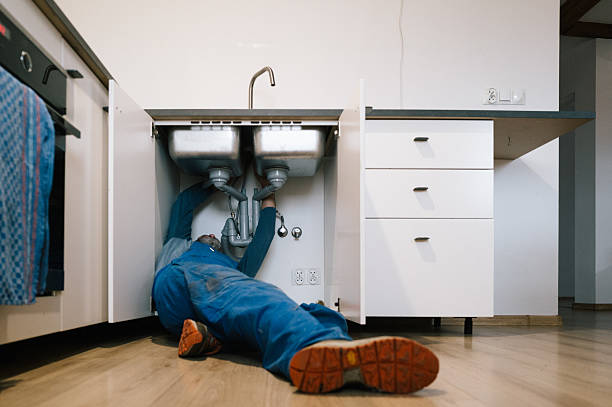 Professional Emergency Plumber technician working in Northville, MI